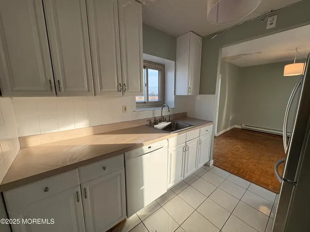 a kitchen with a sink and cabinets
