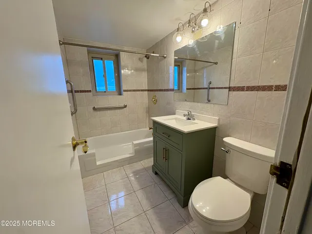 a bathroom with a sink and toilet
