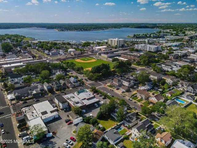 a view of a patio with chairs and a potted plant