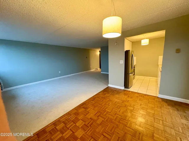 a view of a livingroom with wooden floor
