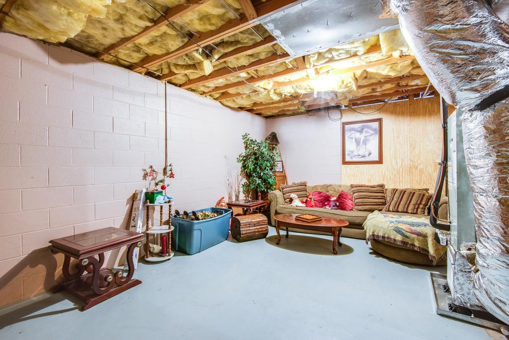340 Burgess Road Dickson, TN 37055 - Photo 19 of 25 Den in basement is heated & cooled-ceiling tiles will remain with home for finishing this space out