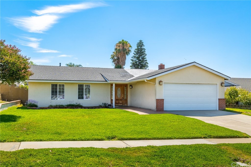 6925 Spinel Avenue Rancho Cucamonga, CA 91701 - Photo 1 of 1 a view of a house with a big yard and potted plants