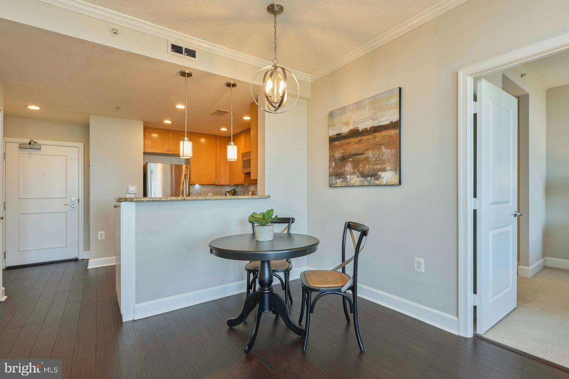 3650 South Glebe Road, Unit 652 Arlington, VA 22202 - Photo 12 of 54 a view of a dining room with furniture and wooden floor