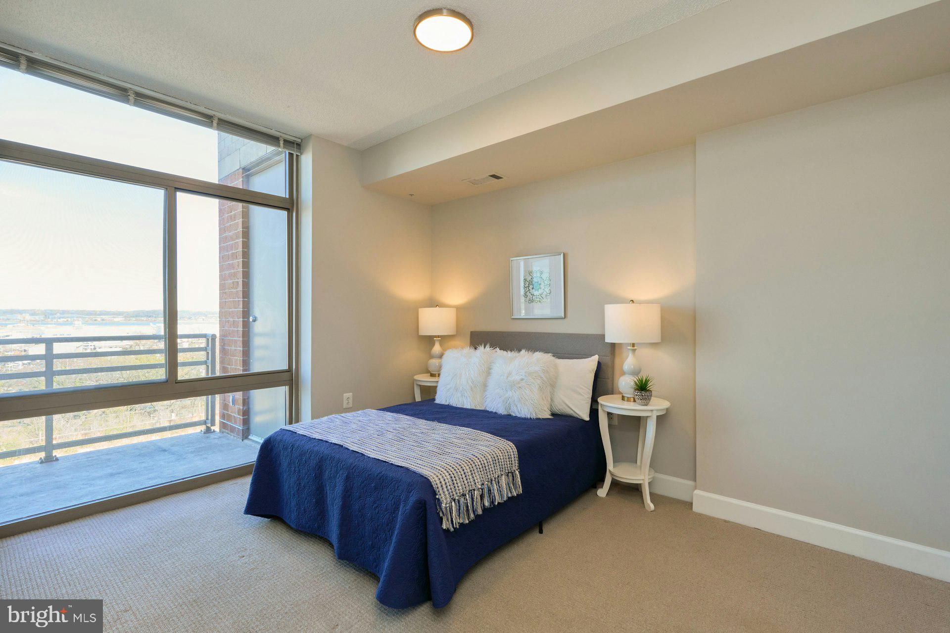 3650 South Glebe Road, Unit 652 Arlington, VA 22202 - Photo 15 of 54 a bedroom with a large bed and a large window