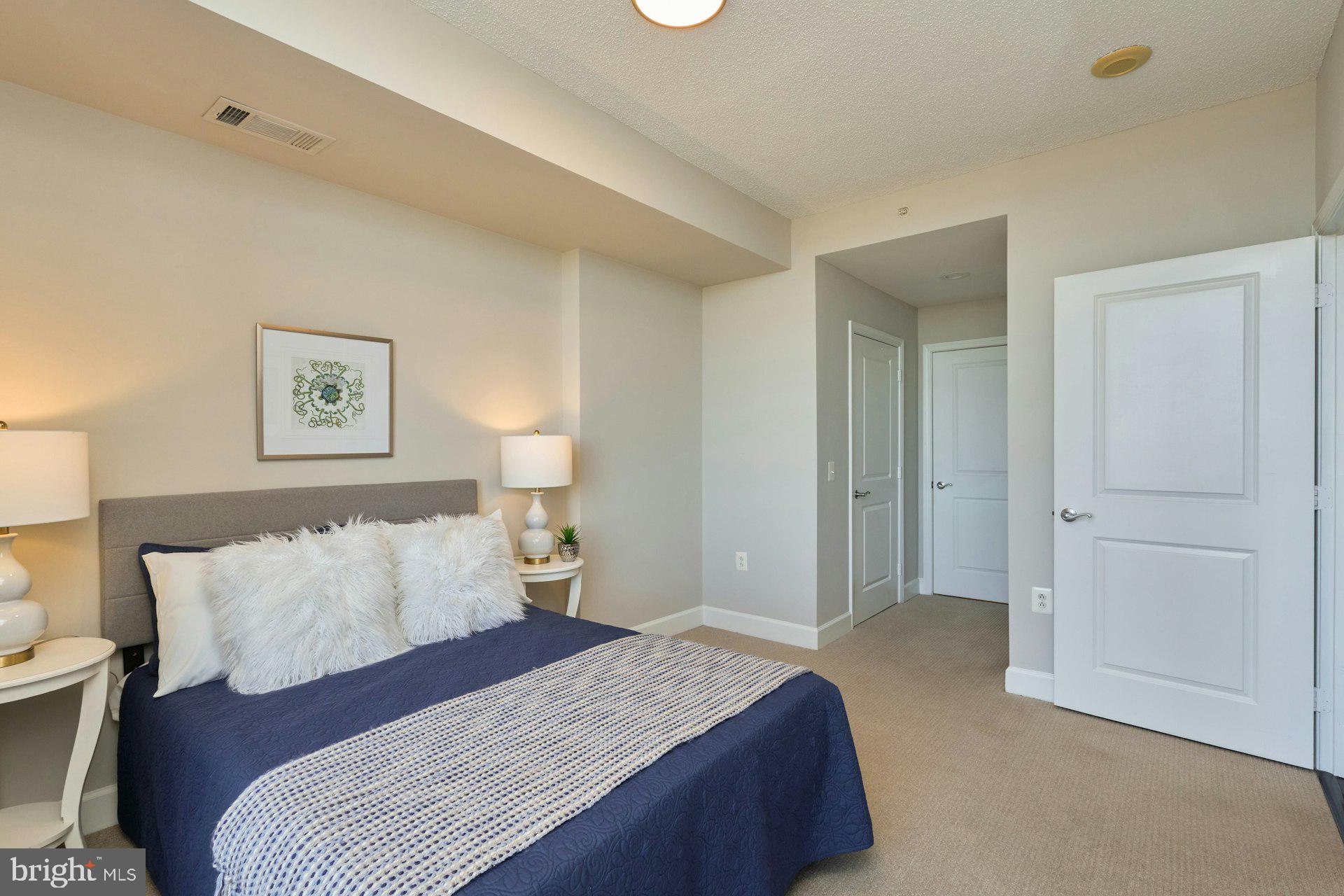 3650 South Glebe Road, Unit 652 Arlington, VA 22202 - Photo 16 of 54 a bedroom with a bed and a night stand