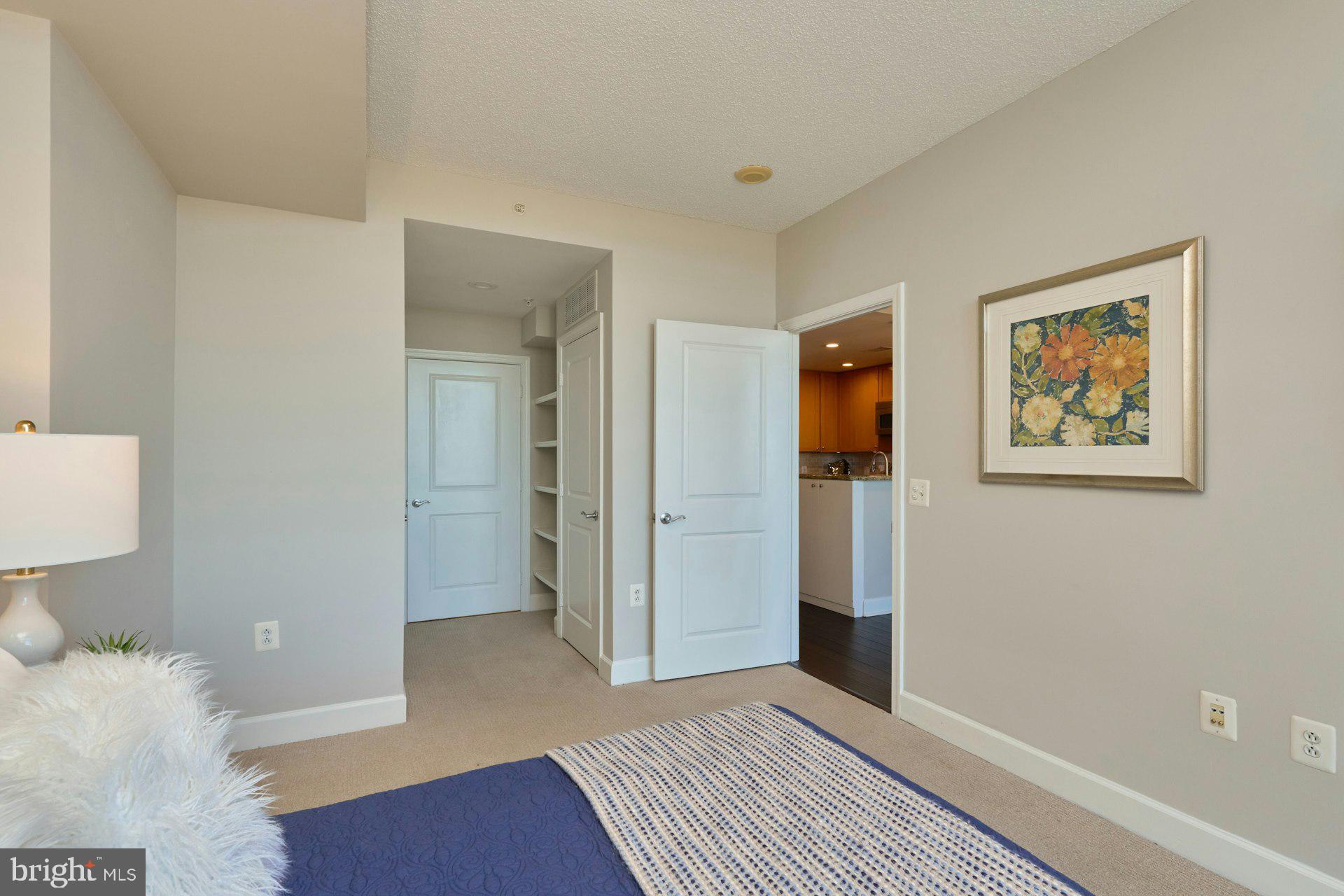 3650 South Glebe Road, Unit 652 Arlington, VA 22202 - Photo 17 of 54 a bedroom with a bed and painting on the wall