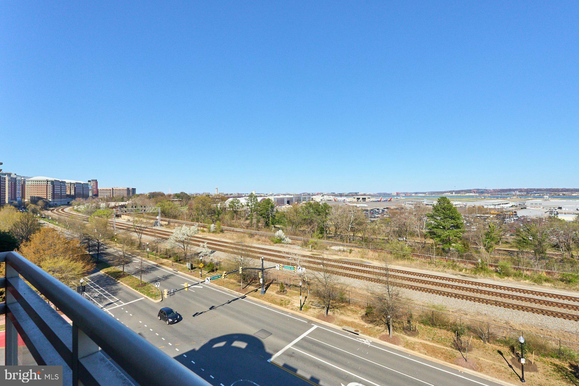 3650 South Glebe Road, Unit 652 Arlington, VA 22202 - Photo 32 of 54 a view of a city from a balcony with furniture
