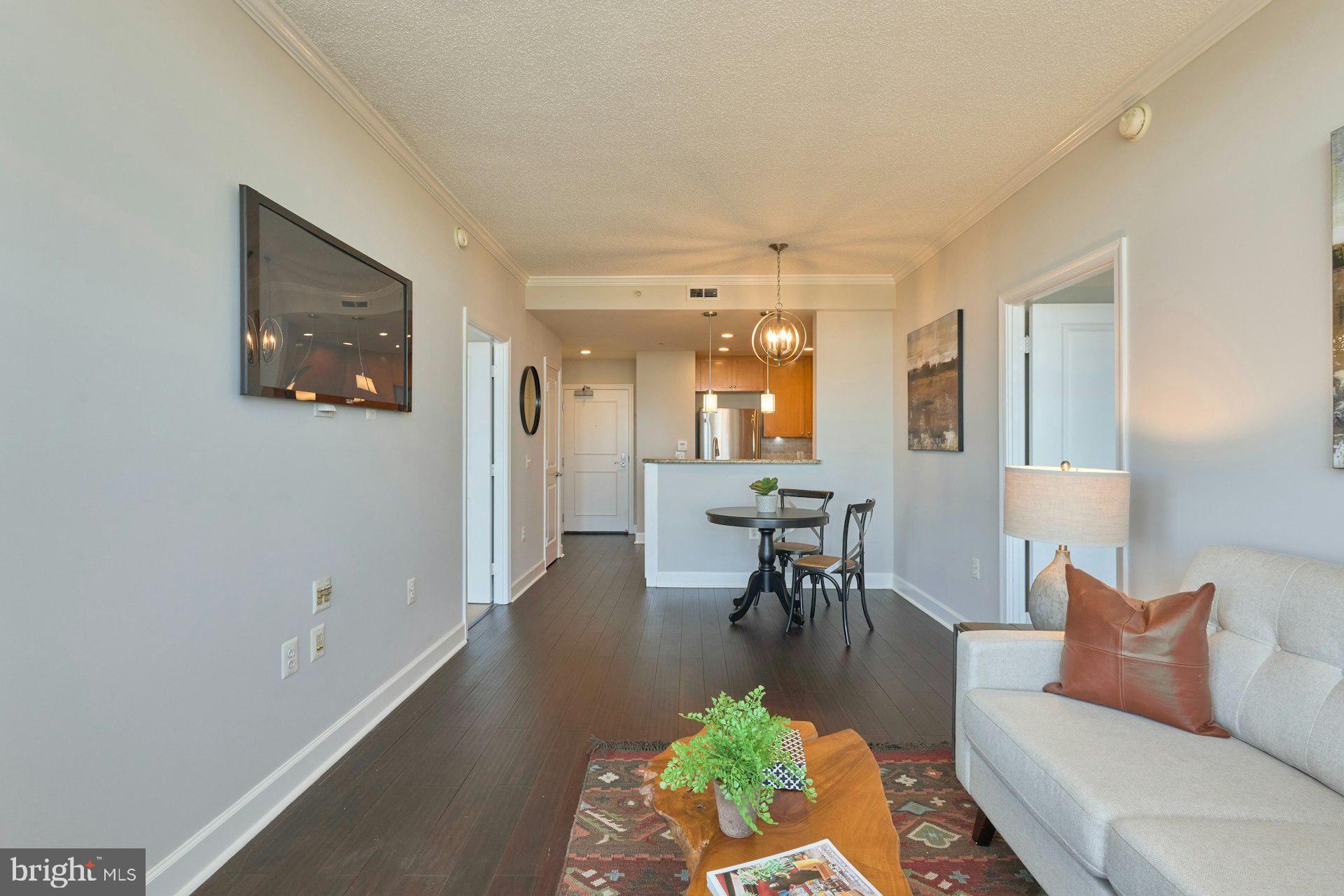 3650 South Glebe Road, Unit 652 Arlington, VA 22202 - Photo 10 of 54 a living room with furniture and a table