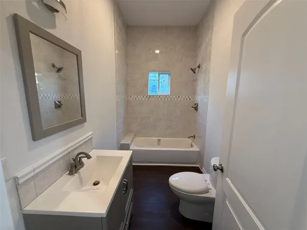 a bathroom with a sink toilet and bathtub