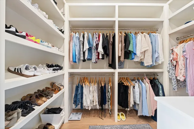 a bedroom with a bed and a lamp