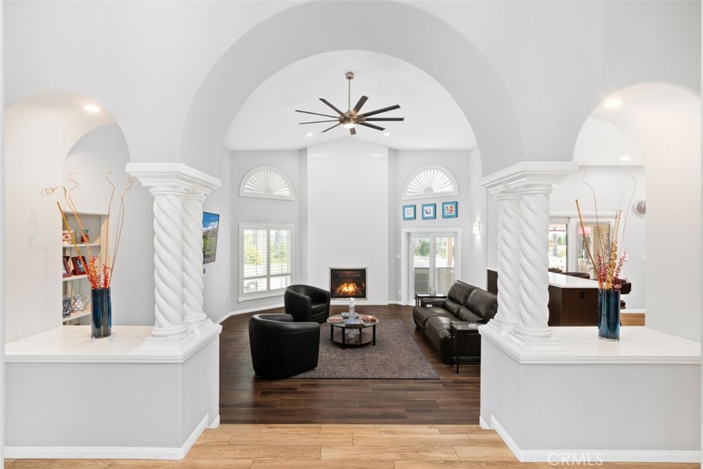 3950 Concordia Lane Fallbrook, CA 92028 - Photo 12 of 51 a living room with furniture a large window and a chandelier