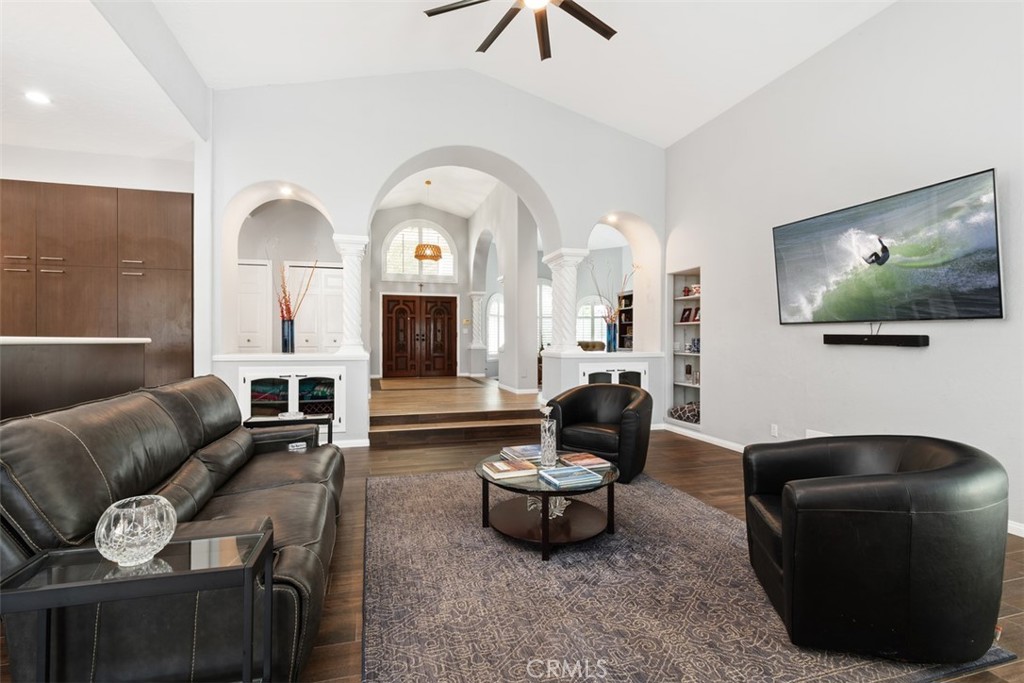 3950 Concordia Lane Fallbrook, CA 92028 - Photo 14 of 51 a living room with furniture a flat screen tv and a large window