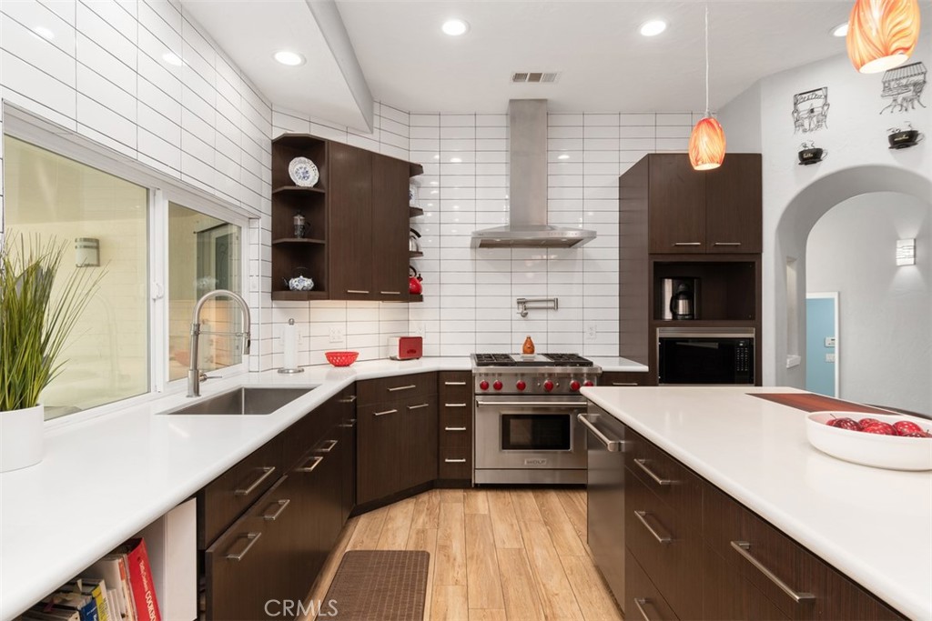 3950 Concordia Lane Fallbrook, CA 92028 - Photo 18 of 51 a kitchen with stainless steel appliances granite countertop a sink stove and refrigerator