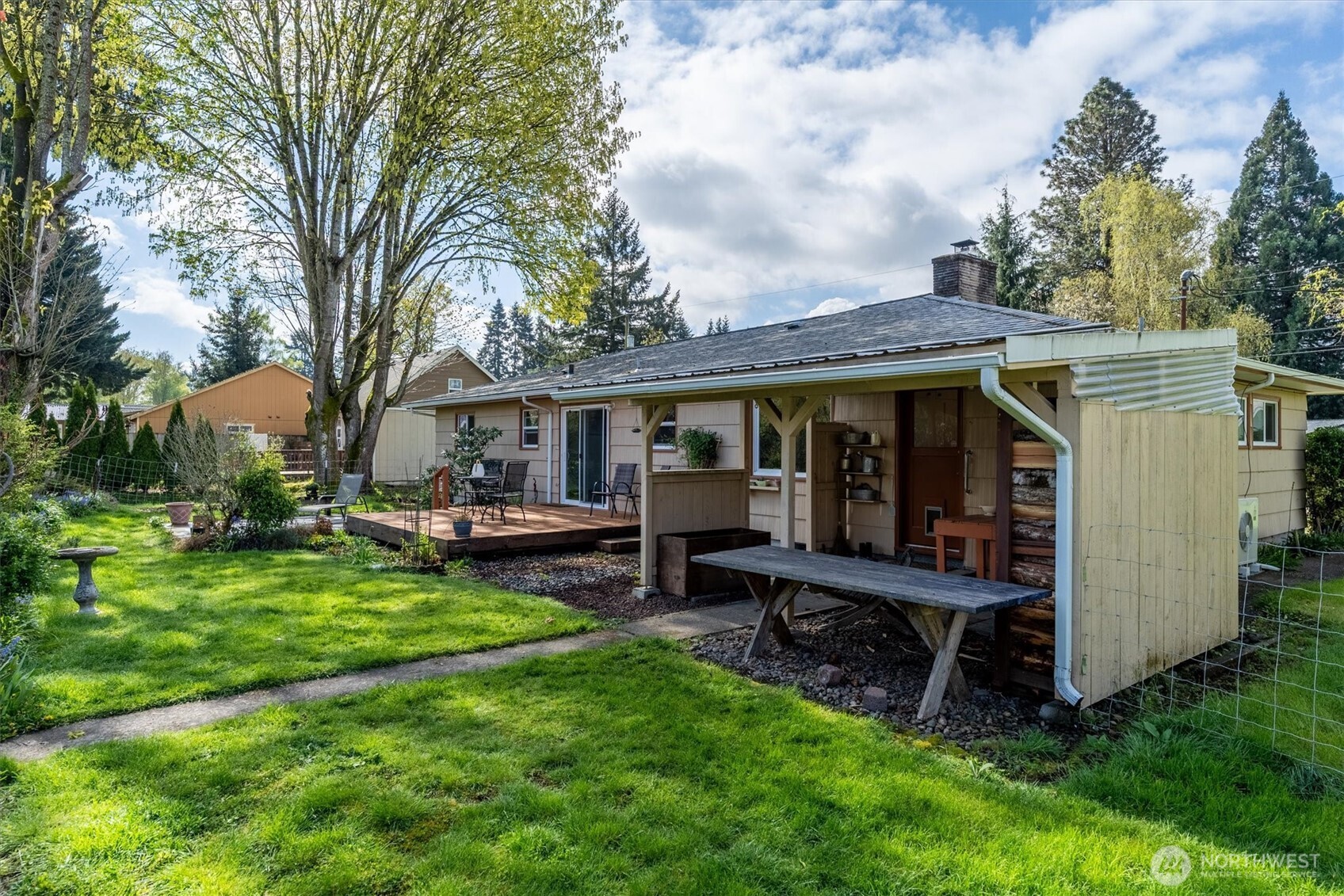 3302 Pine Street Longview, WA 98632 - Photo 22 of 39 a view of a house with a backyard and chairs