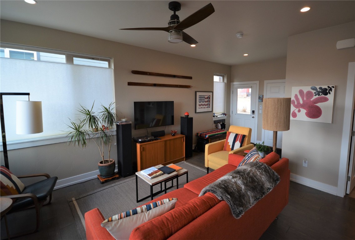 13 Haymaker Street Silverthorne, CO 80498 - Photo 2 of 21 a living room with furniture a flat screen tv and a window