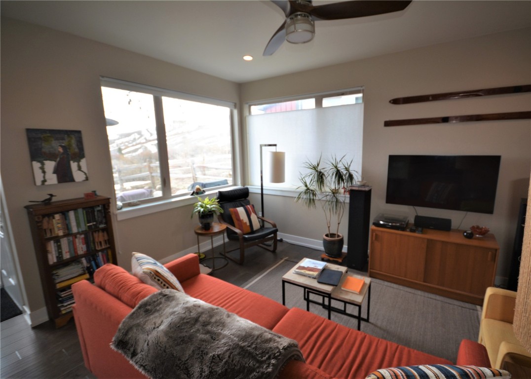 13 Haymaker Street Silverthorne, CO 80498 - Photo 3 of 21 a living room with furniture a flat screen tv and a large window