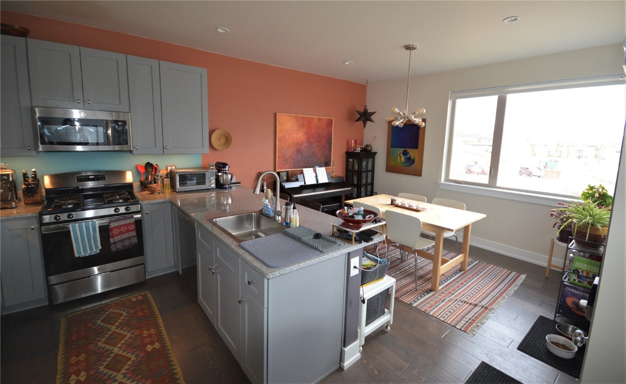 13 Haymaker Street Silverthorne, CO 80498 - Photo 4 of 21 a kitchen with a sink appliances and cabinets