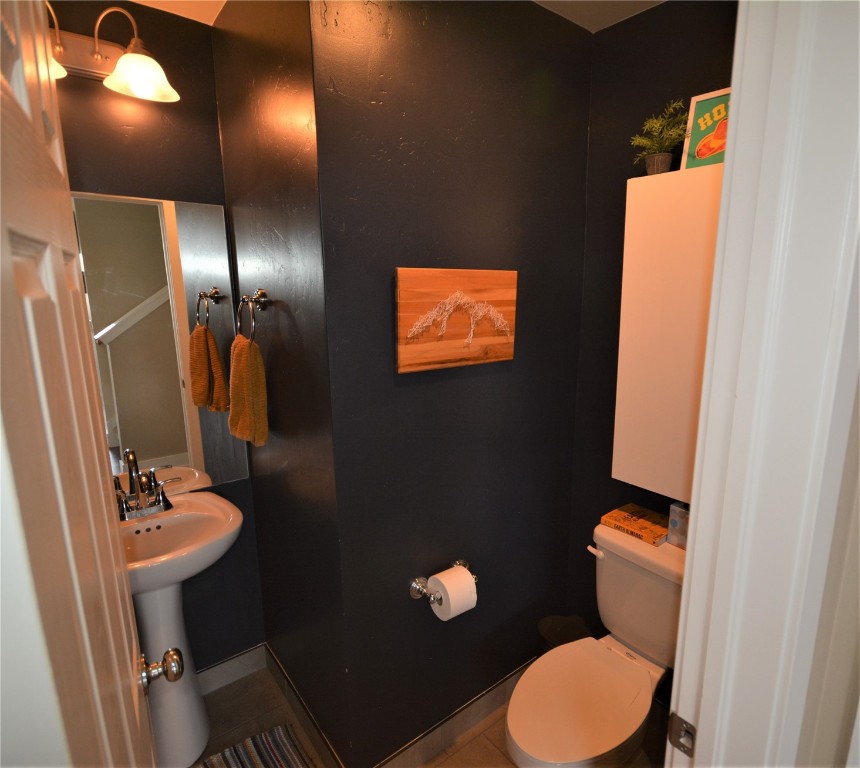 13 Haymaker Street Silverthorne, CO 80498 - Photo 7 of 21 a bathroom with a toilet sink and mirror