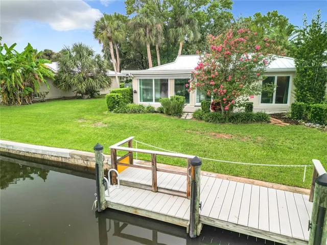 a view of a wooden deck and a yard
