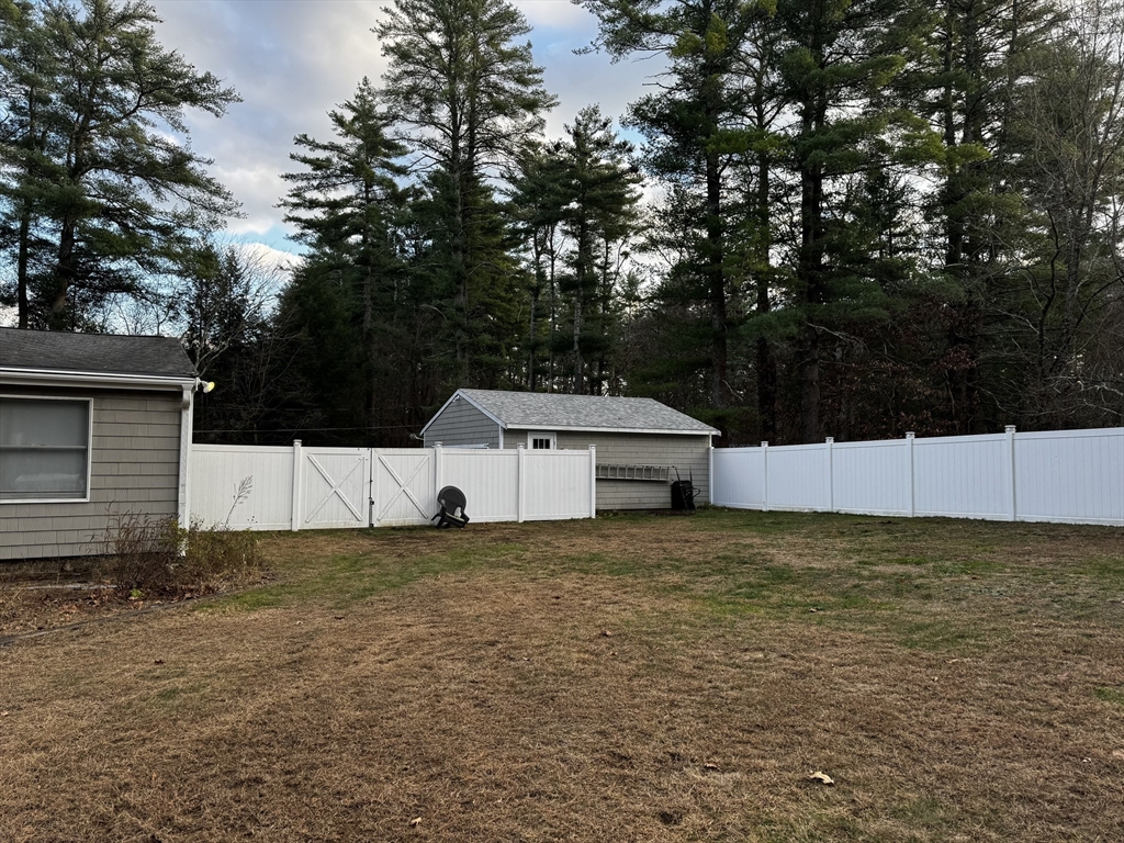 36 Rowley Road Topsfield, MA 01983 - Photo 4 of 29 a view of a house with a yard