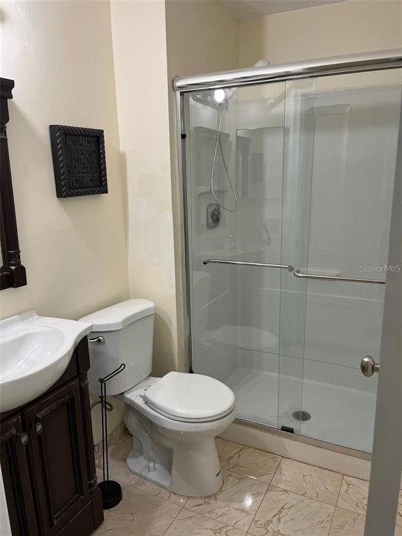 1400 Southwest 85th Terrace Pembroke Pines, FL 33025 - Photo 3 of 11 a bathroom with a toilet a sink and shower