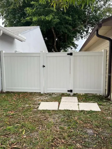 a view of a backyard of the house