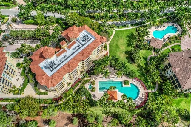 an aerial view of a house with a yard and garden