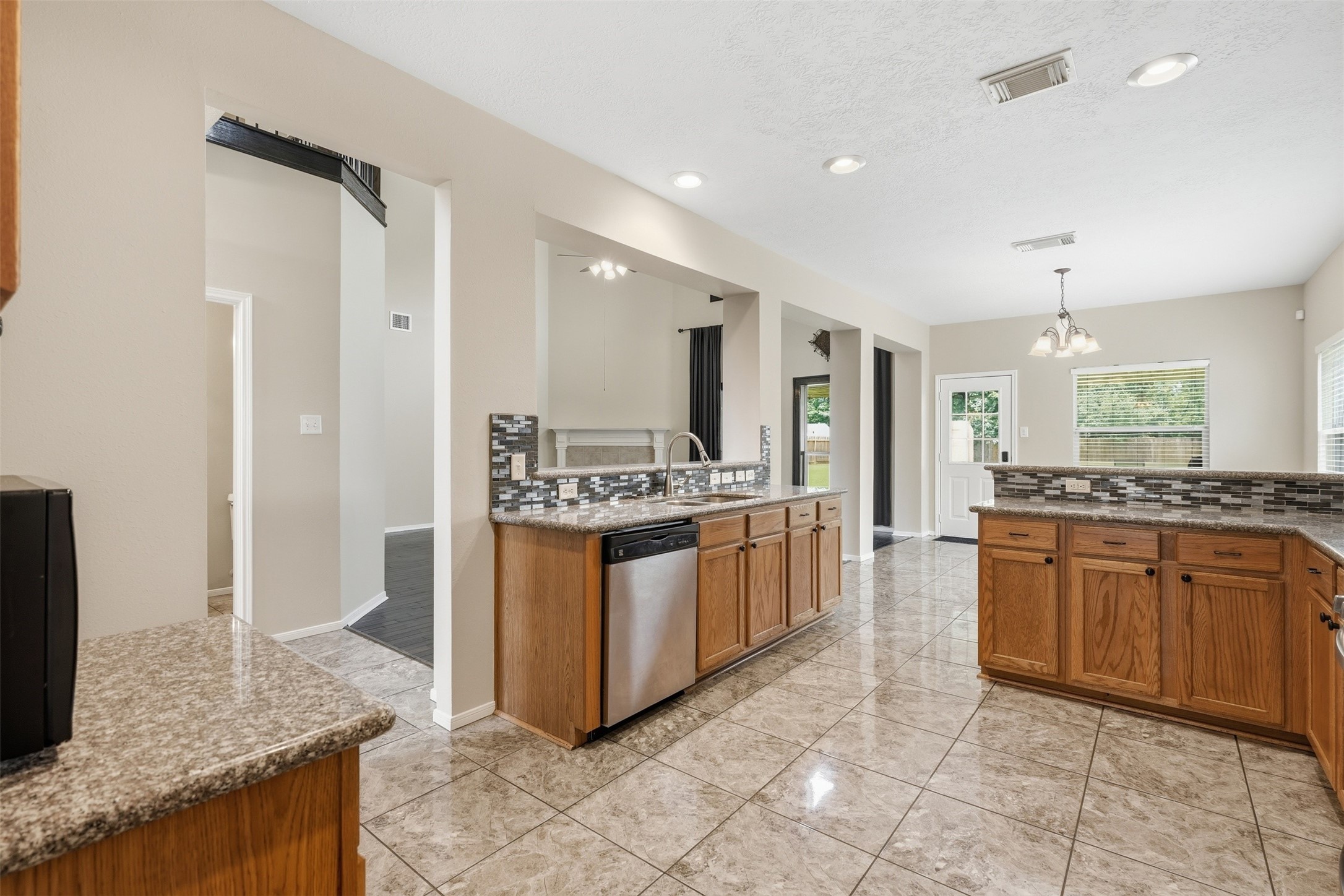 22914 Breton Point Drive Spring, TX 77373 - Photo 3 of 11 Spacious kitchen ideal for entertaining open to the family room and breakfast area.
