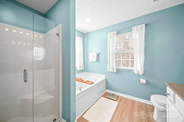 a bathroom with a bathtub and a shower