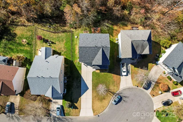 an aerial view of houses with outdoor space
