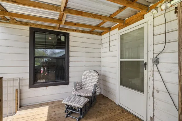 a front view of a house with outdoor seating