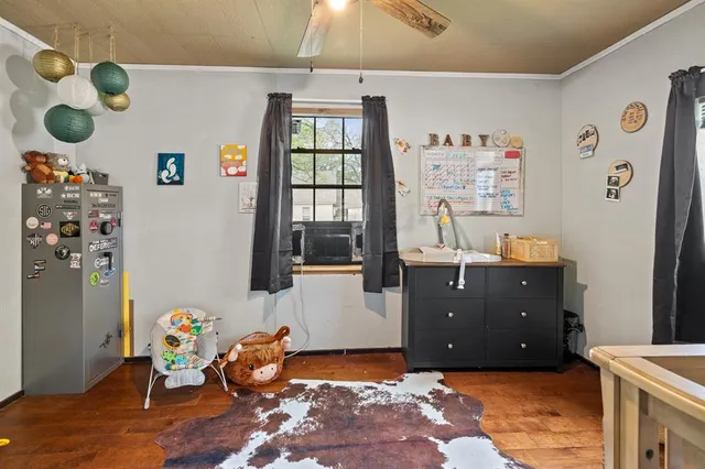 a bed room with a bed and a window