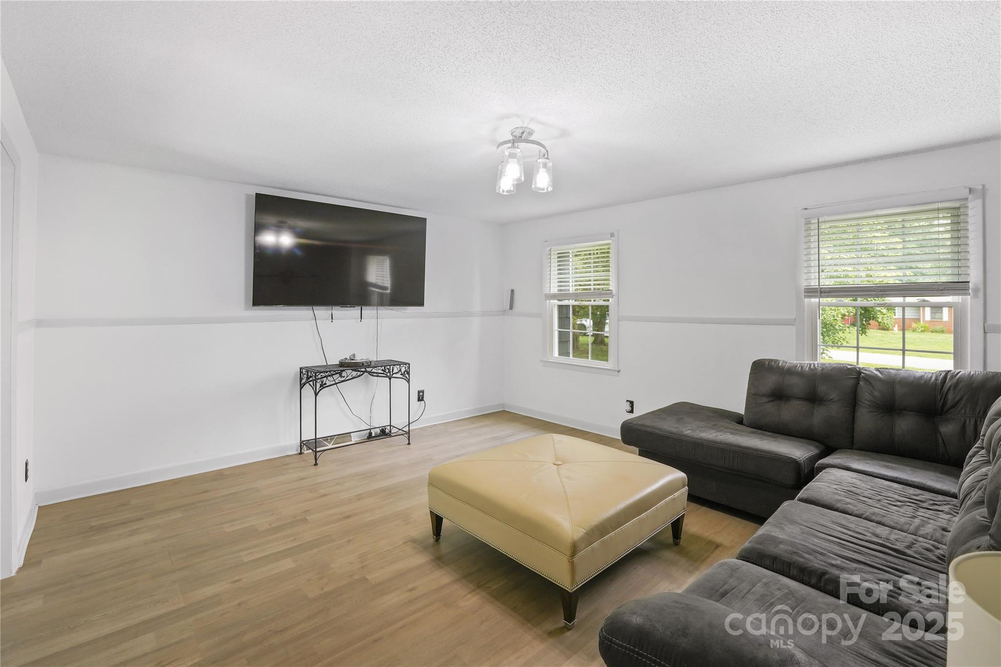 1867 Shannon Drive Conover, NC 28613 - Photo 3 of 19 a living room with furniture and a flat screen tv