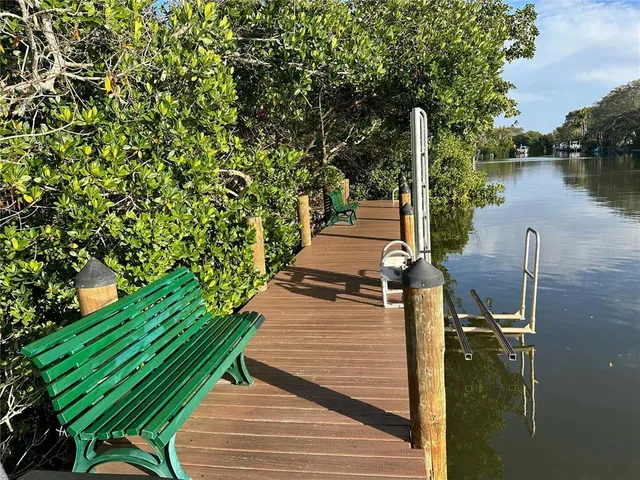 a view of a wooden deck and a lake view