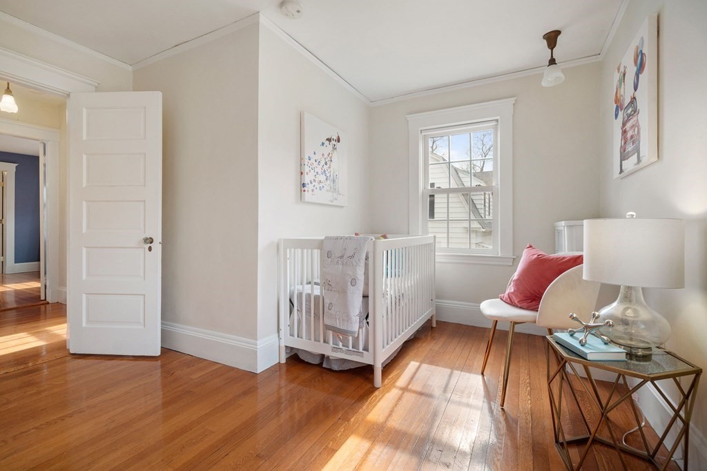 22 Ardmore Road Newton, MA 02465 - Photo 12 of 18 a bedroom with furniture and wooden floor