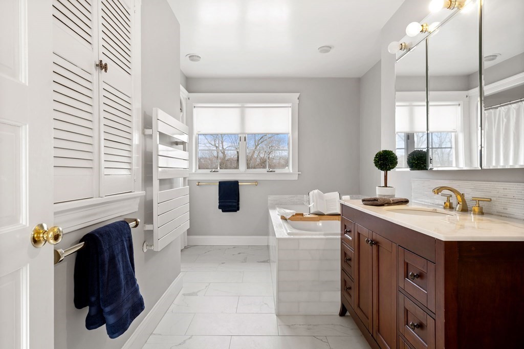 22 Ardmore Road Newton, MA 02465 - Photo 13 of 18 a bathroom with a sink double vanity and a mirror