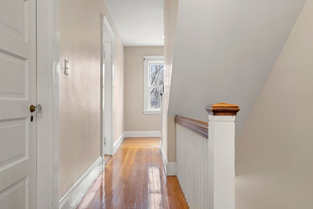 22 Ardmore Road Newton, MA 02465 - Photo 14 of 18 a view of a hallway with wooden floor and closet