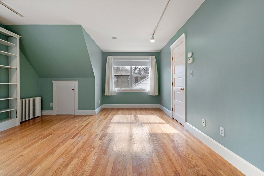 22 Ardmore Road Newton, MA 02465 - Photo 15 of 18 an empty room with wooden floor and windows