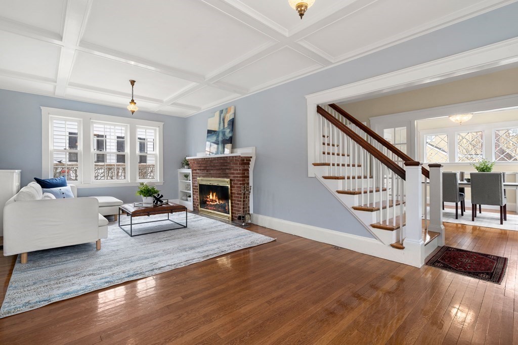 22 Ardmore Road Newton, MA 02465 - Photo 2 of 18 a living room with furniture and a fireplace
