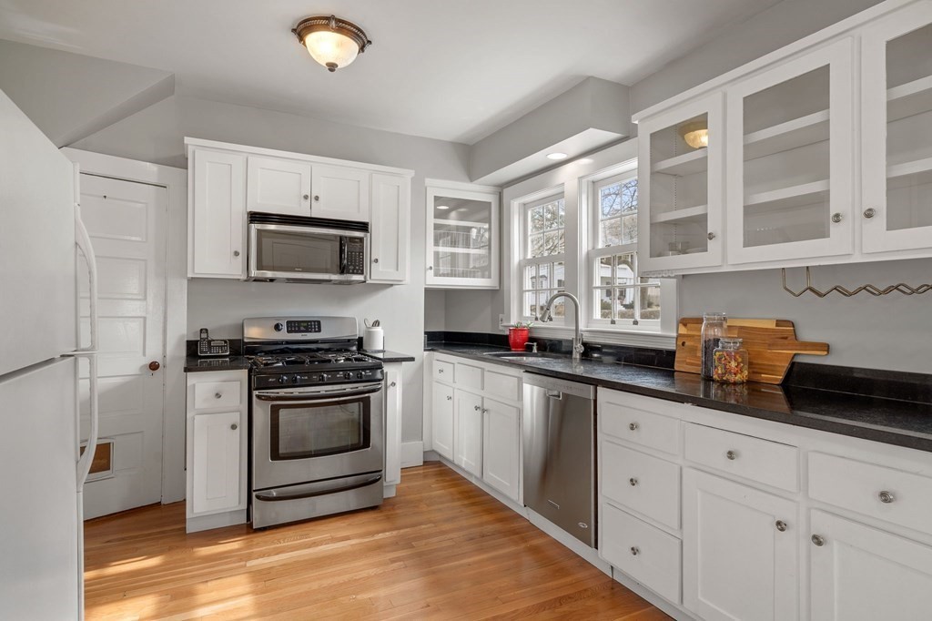 22 Ardmore Road Newton, MA 02465 - Photo 7 of 18 a kitchen with granite countertop a sink stainless steel appliances and cabinets