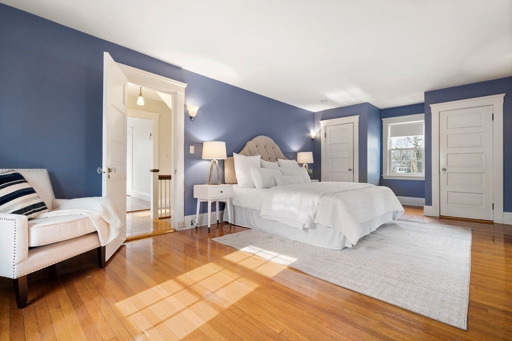 22 Ardmore Road Newton, MA 02465 - Photo 10 of 18 a spacious bedroom with a bed a mirror and lamp