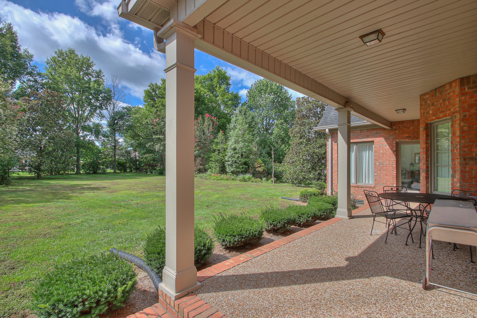 521 Robards Circle Old Hickory, TN 37138 - Photo 12 of 50 a view of a patio with table and chairs potted plants with wooden fence