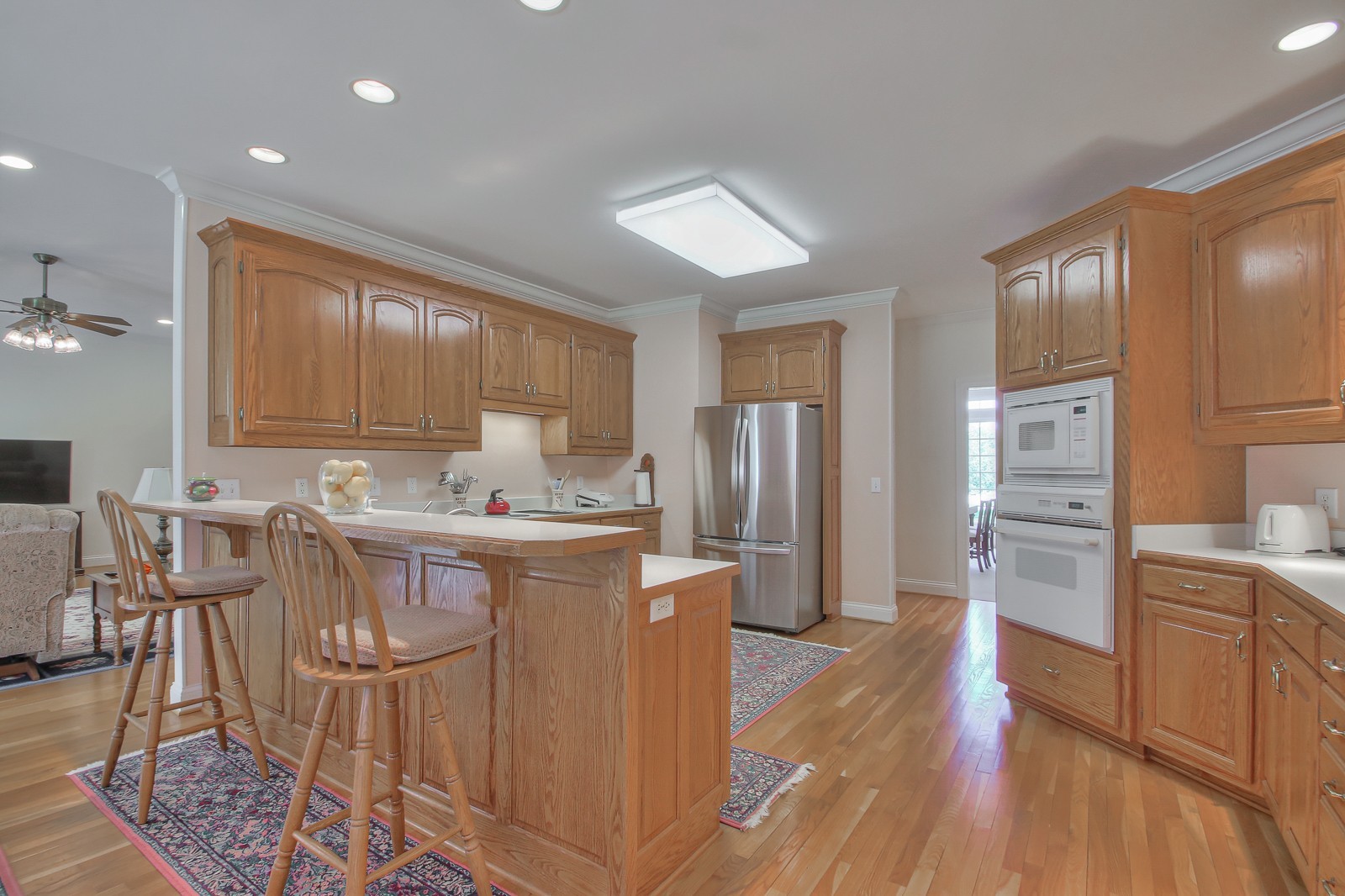 521 Robards Circle Old Hickory, TN 37138 - Photo 30 of 50 a kitchen with kitchen island wooden floors cabinets and stainless steel appliances