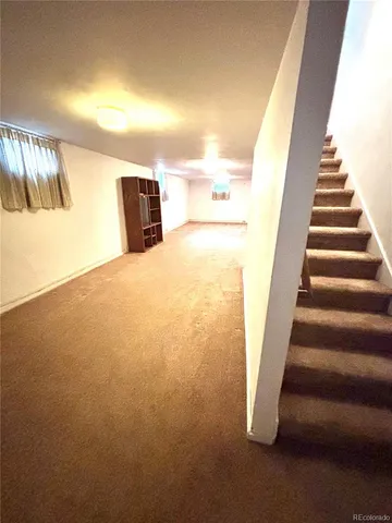 a view of entryway and kitchen