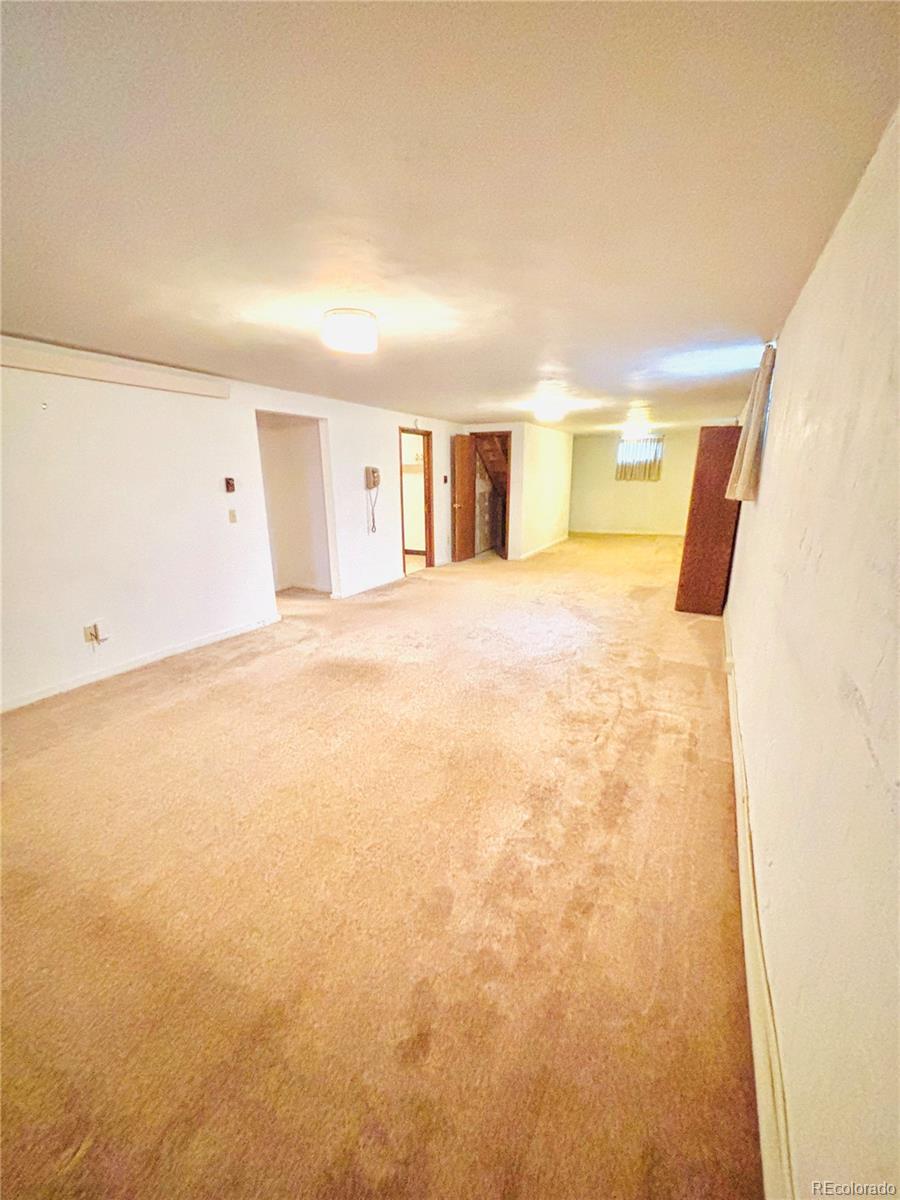 503 Elm Street Fort Morgan, CO 80701 - Photo 20 of 26 a view of empty room with wooden floor