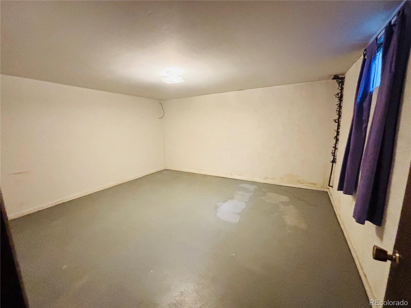 503 Elm Street Fort Morgan, CO 80701 - Photo 24 of 26 an empty room with stairs