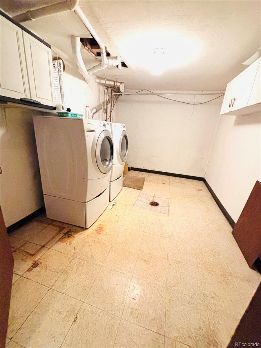 503 Elm Street Fort Morgan, CO 80701 - Photo 26 of 26 a view of a storage & utility room with washer and dryer