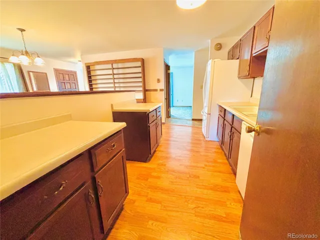 a view of a kitchen with a sink and dishwasher