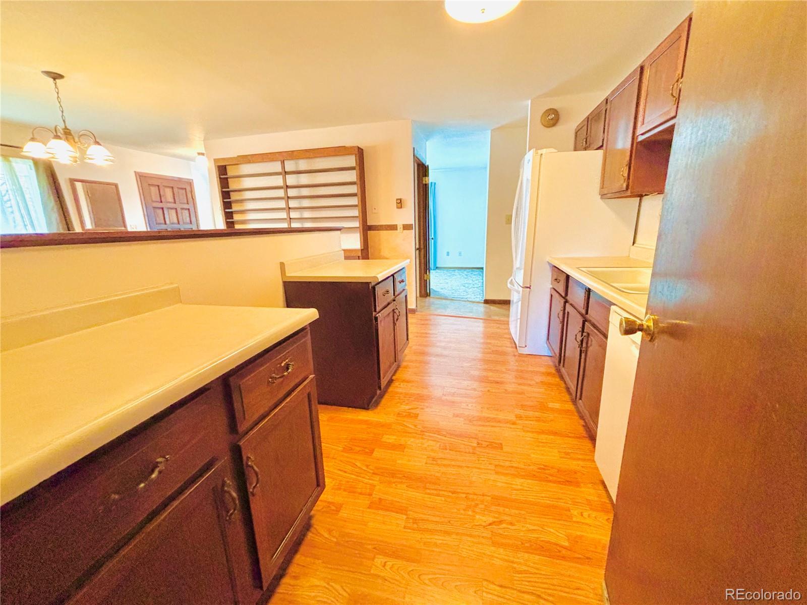 503 Elm Street Fort Morgan, CO 80701 - Photo 6 of 26 a view of a kitchen with a sink and dishwasher