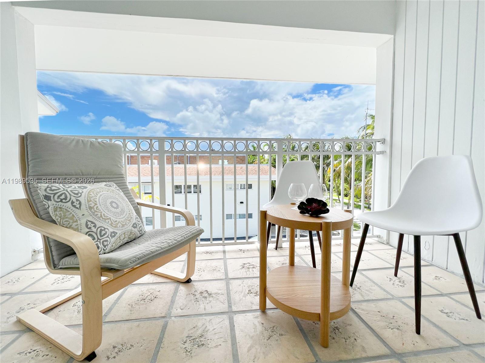 290 Sunrise Drive, Unit 3F Key Biscayne, FL 33149 - Photo 13 of 19 a view of a living room and a porch